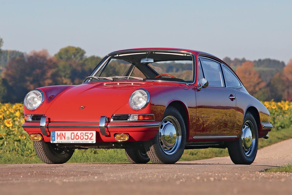 Early Porsche 911 in a 1960s showroom