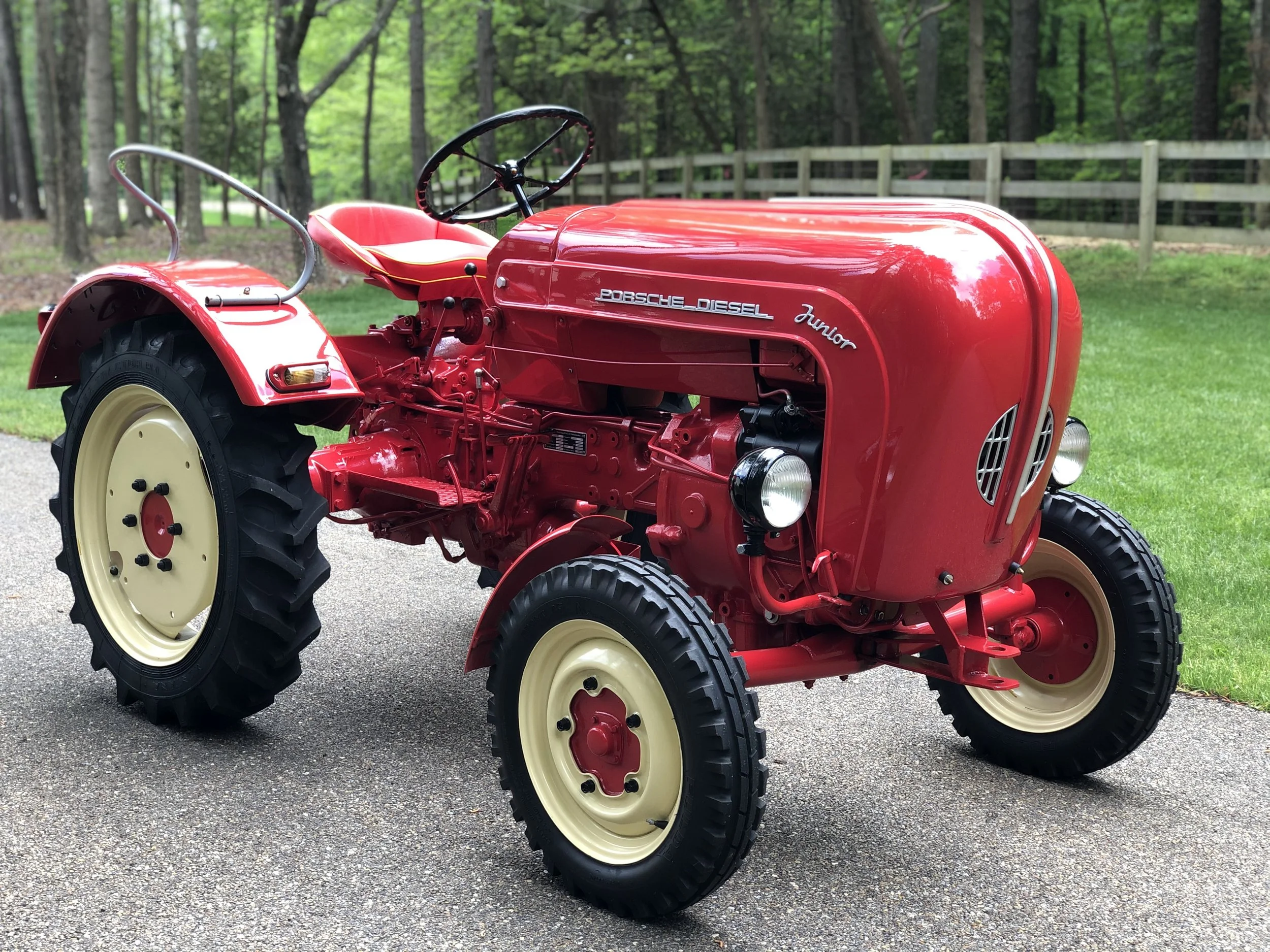 Red Porsche Diesel Junior tractor in a field